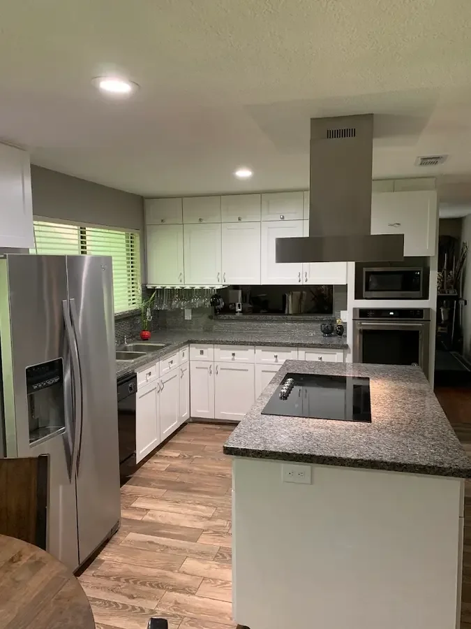 Remodeled kitchen with custom white cabinetry